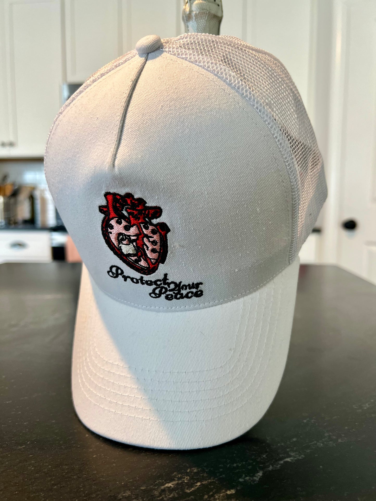 DyLN Rd Trucker Hat PROTECT YOUR PEACE embroidery